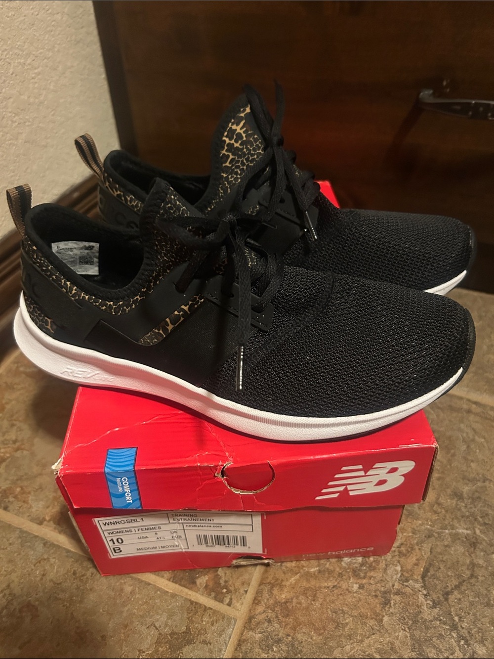 New Balance Women’s Black Sneakers with Gold Leopard Accent